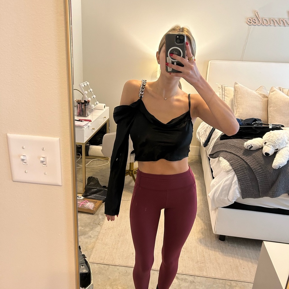 Stylish Black One-Shoulder Top with Burgundy Leggings